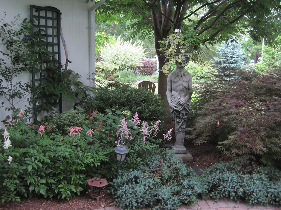 Shady Bed with Pan Statue